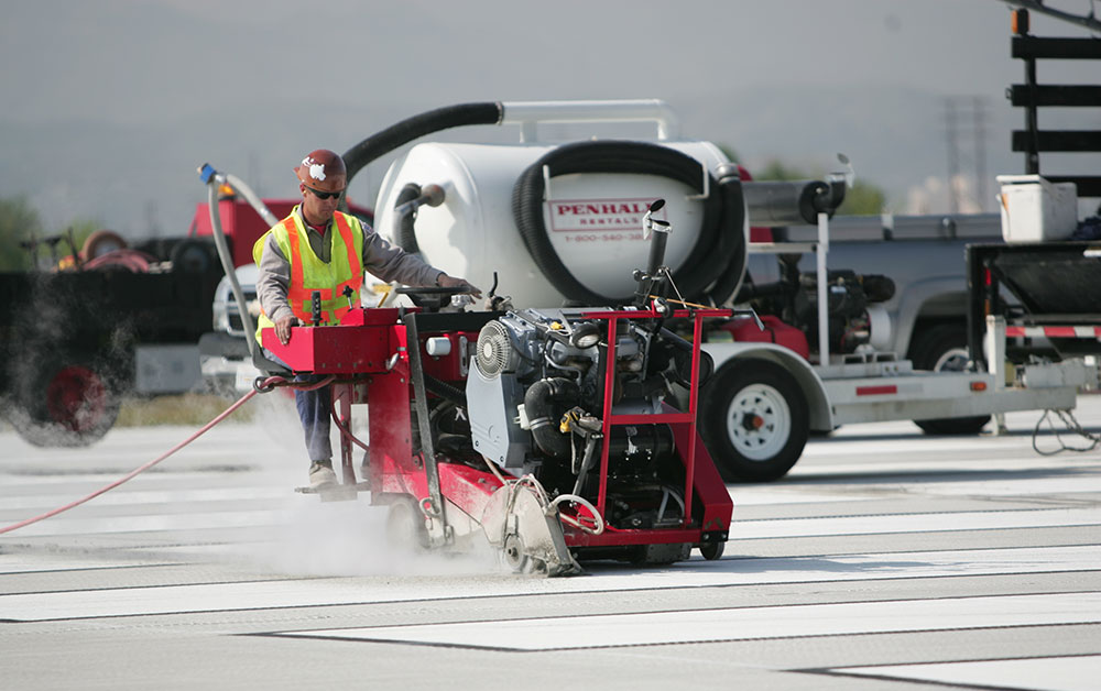 machinery doing airport runway grooving