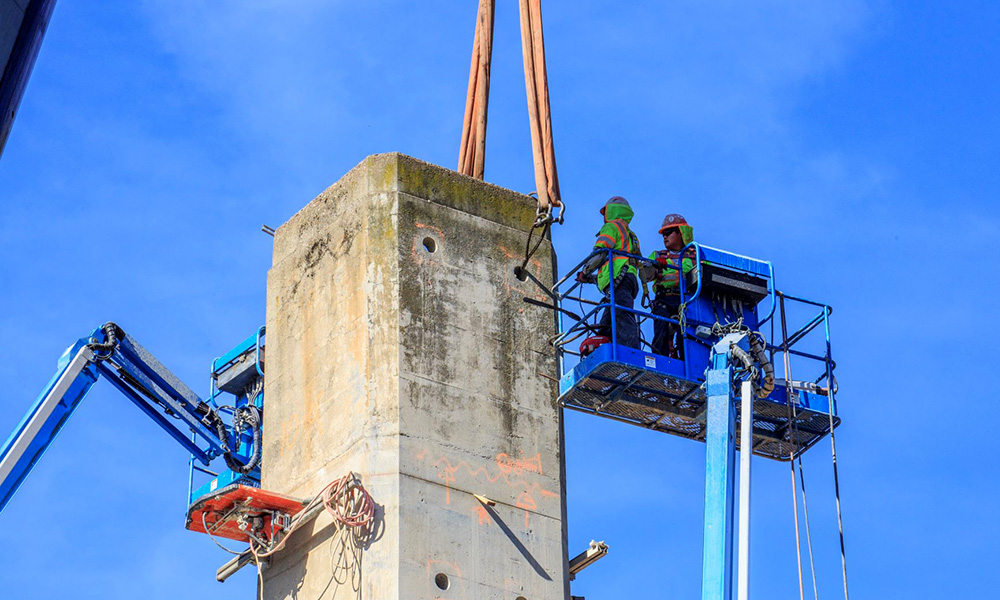 Penhall team members working on chimney section to be cut